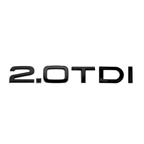 Badge de coffre 2.0 TDI noir monté sur le hayon d'une Audi