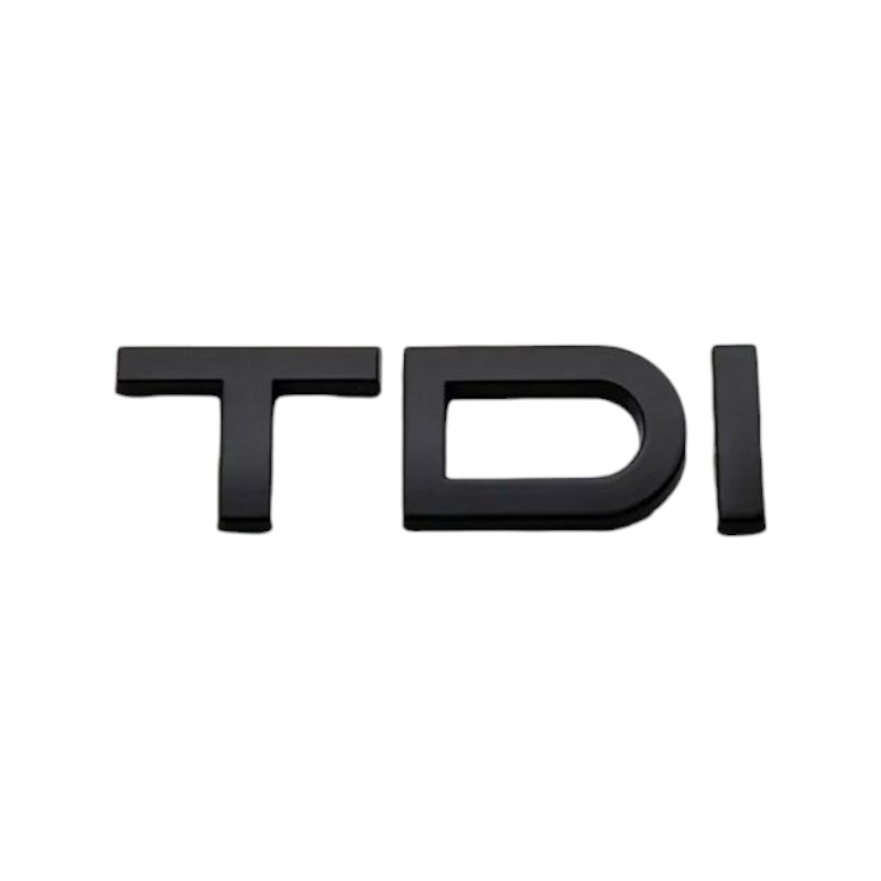 Pose du badge de coffre TDI noir sur le hayon d'une Audi